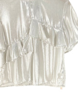 Blusa satinada con vuelos