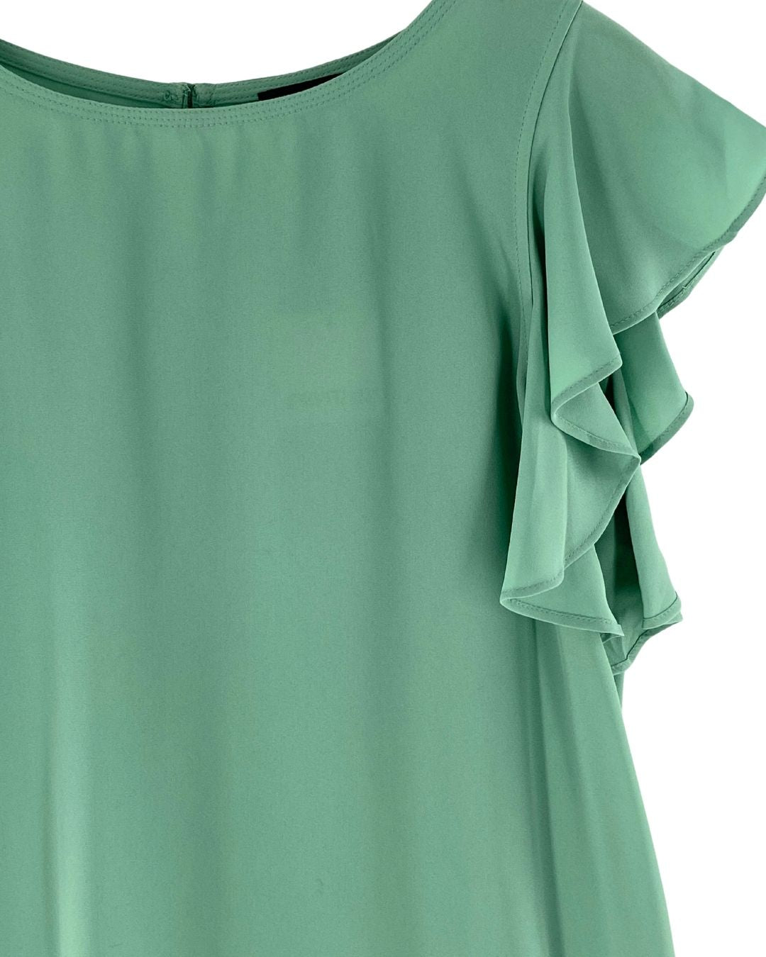 Blusa tralúcida con vuelos