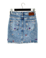 Falda mini en denim rigido