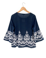 Blusa de puños amplios