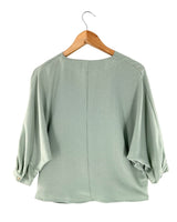 Blusa cruzada oversize