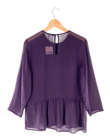 Blusa traslucida manga larga