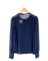 Blusa traslucida con recamado