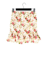 Falda mini en ojalillo print