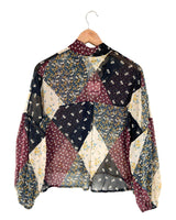 Blusa traslucida hombro caido