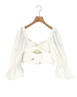 Blusa crop manga larga cruzada