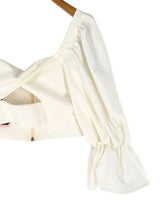 Blusa crop manga larga cruzada