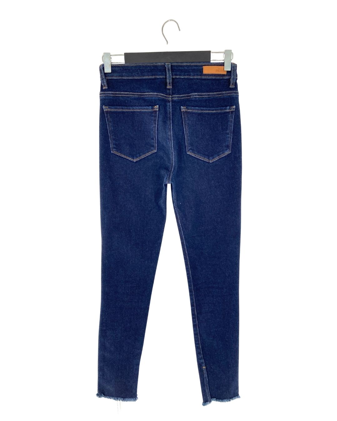 Jean skinny tiro alto