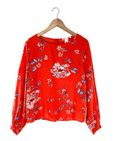 Blusa abotonada en espalda