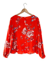 Blusa abotonada en espalda