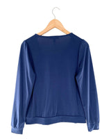 Blusa cruzada manga larga