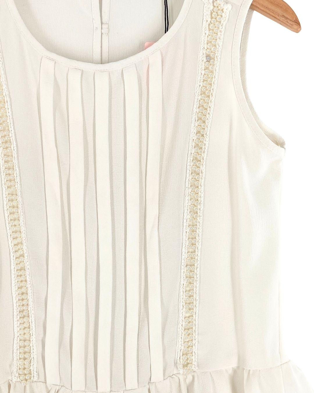 Blusa sleeveless con pedreria