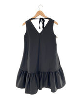Vestido mini con vuelo anudado