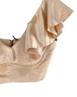 Blusa crop satinada con vuelo