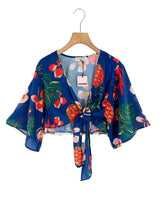 Blusa anudada mangas amplias