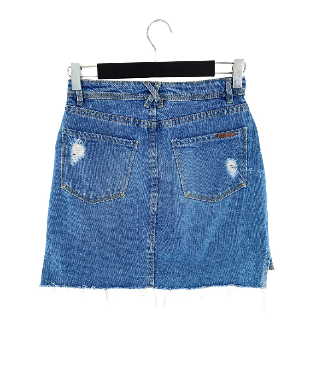 Falda mini en denim rigido
