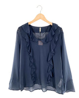 Blusa traslucida con vuelo
