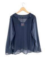 Blusa traslucida con vuelo