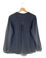 Blusa manga larga traslucida