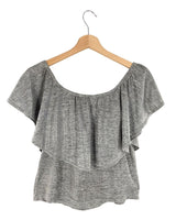 Blusa con capa brillante
