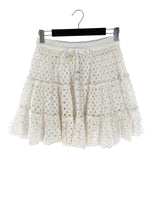 Falda mini en ojalillo
