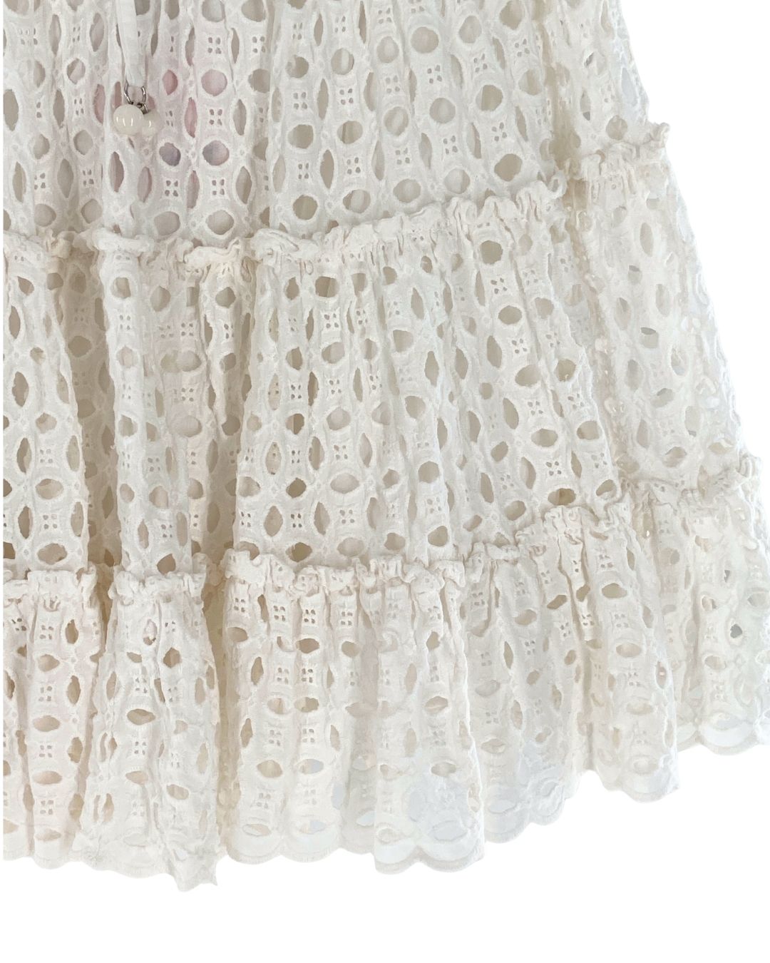 Falda mini en ojalillo