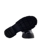 Mocasines en cuero con taches