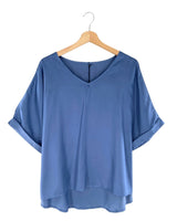 Blusa satinada amplia