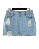 Falda mini en denim destroyed
