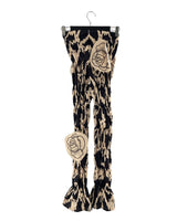 Pantalon encauchado print aves