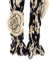 Pantalon encauchado print aves