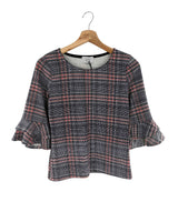 Blusa con vuelos en puños