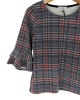 Blusa con vuelos en puños