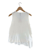 Blusa sleeveless con vuelo