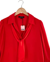 Blusa manga larga con lazo